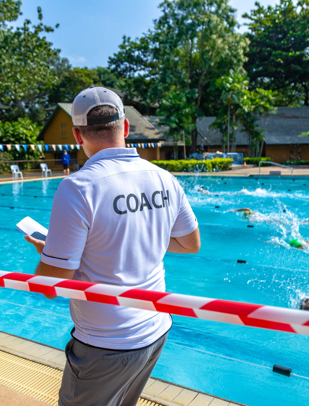 women at rec center front desk greeting members