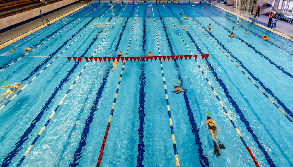 group of men playing basketball in a gym