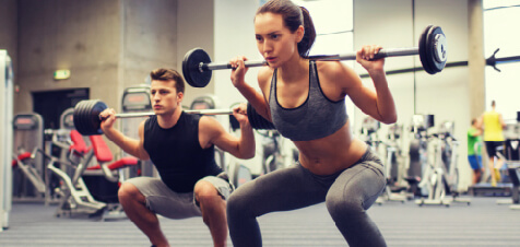 women lifting weights at rec center